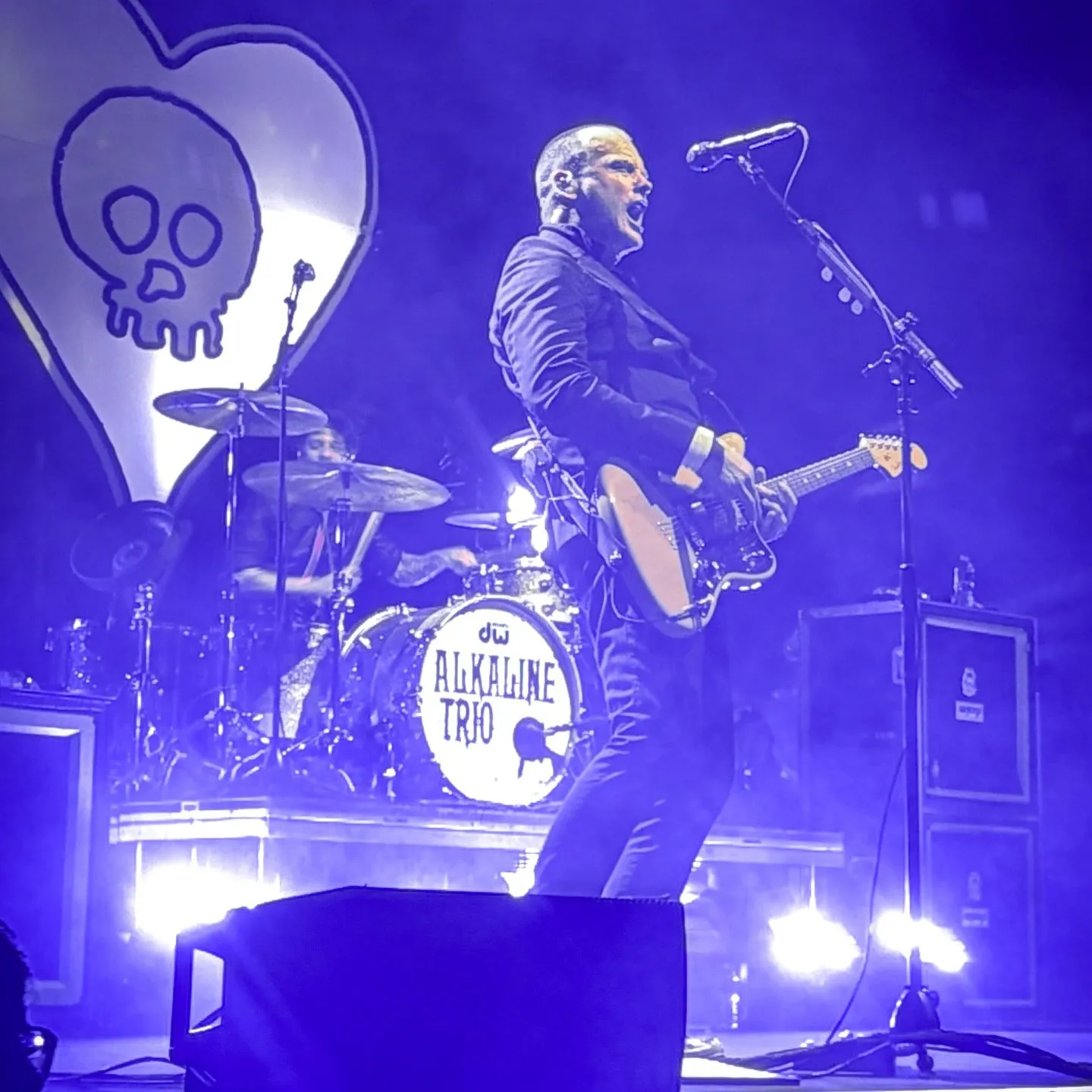 Alkaline Trio washed in blue stage light