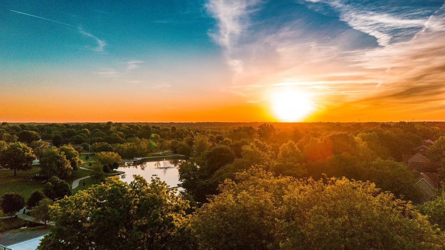 Golden sunrise over treetops at Sar-Ko-Par Trails Park